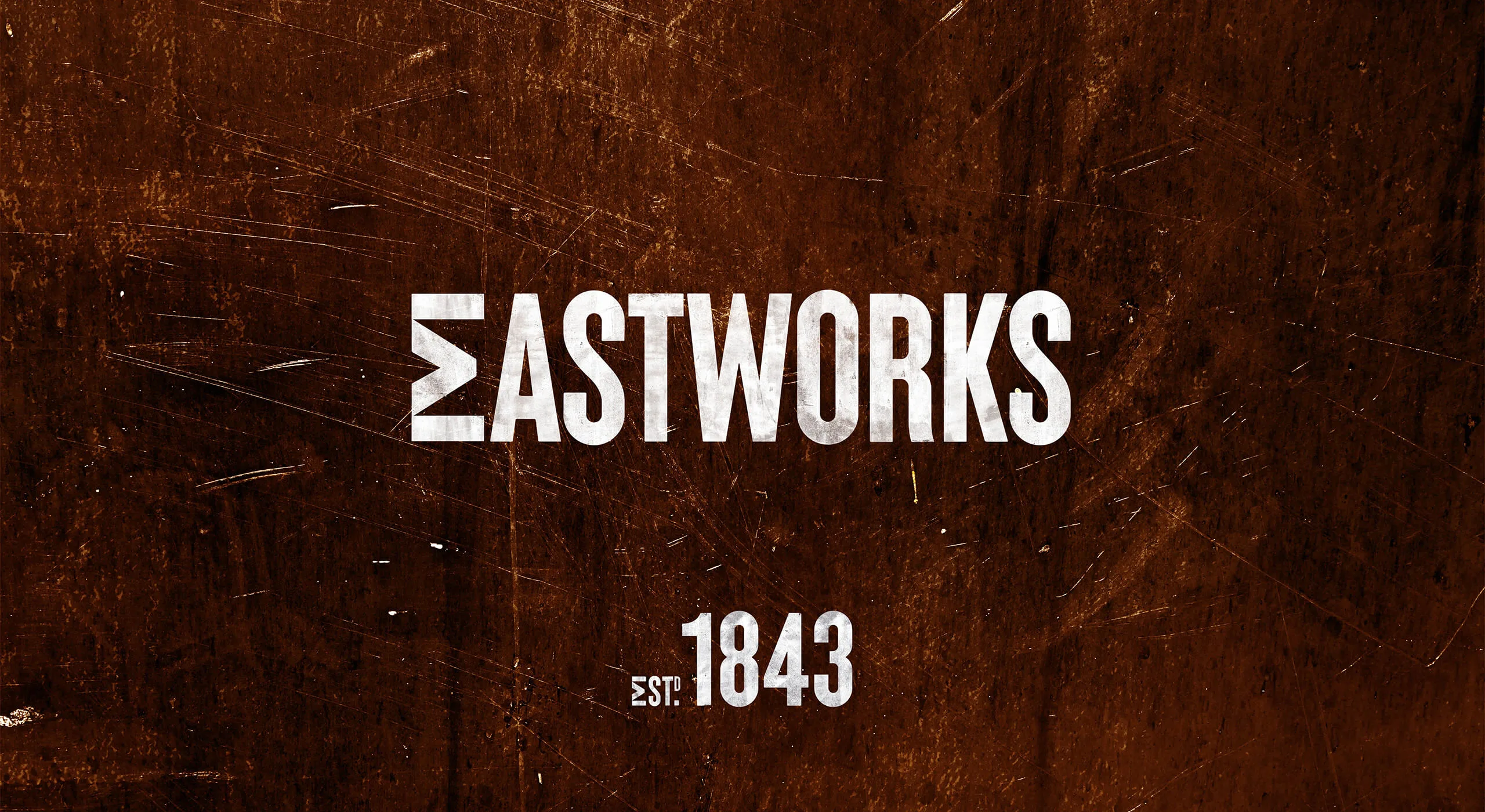Eastworks logo on distressed background.