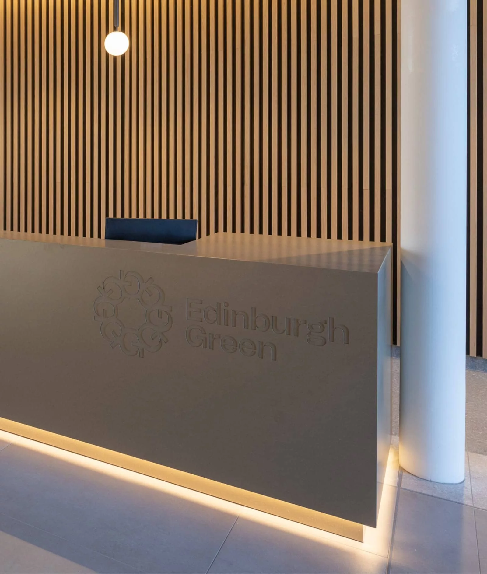 Edinburgh Green branded reception desk.